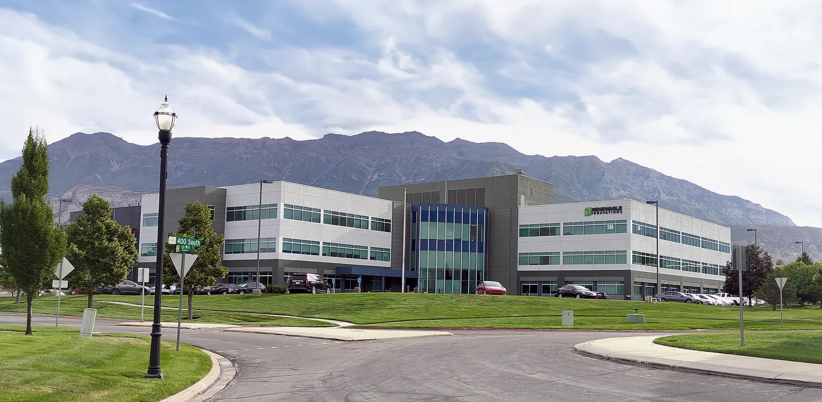 Renewable Innovations headquarters building in Lindon, Utah, with the Wasatch mountains behind